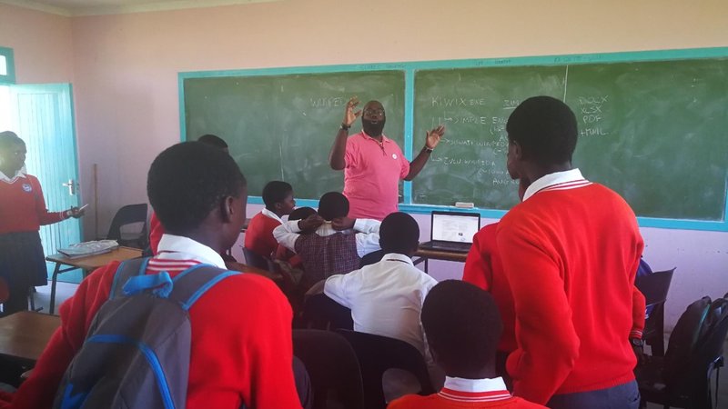 Kirby with his students.jpg