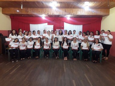 Women with their certificates