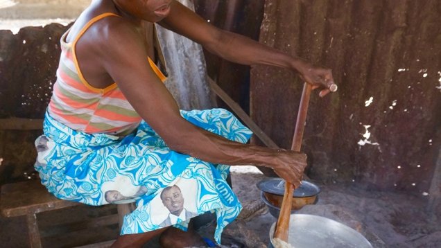 Kotoko mixes corn flower into water to make akpa to sell at the local high school and ultimately support her family. Income generating activities like this help women like Kotoko survive while maintaining some independence.