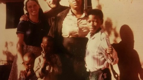 Marie and Kirk with their host family during training in Lesotho.