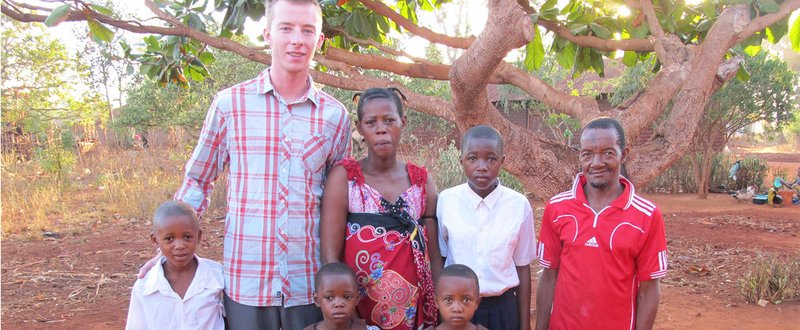 Robbie Lehman with a family in Tanzania