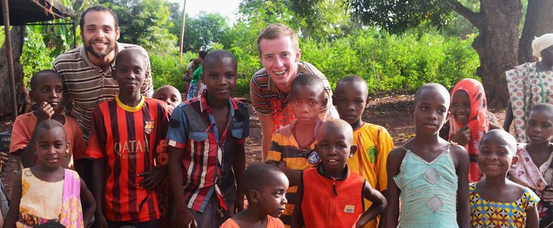 Robbie Lehman with a group of children in Tanzania
